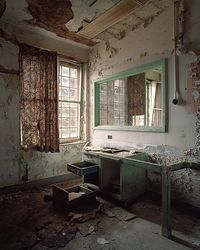 "The walls were peeling, revealing the words they had attempted to hide beneath coats of paint. The drawers had been searched and emptied, their useless contents scattered on the floor ..."