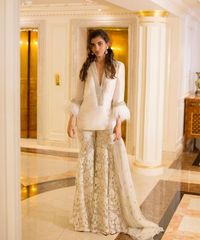Monisha Jaising on Instagram: "“𝐂𝐇𝐄𝐋𝐒𝐄𝐀” Ivory feather sharara Photographer: @thanospoulimenos Models: @nainach Makeup: @beautybyg_thelook Location: @TheBentleyLondonHotel #Monishajaising #monishajaisingcouture #monishajaisingatelier #monishajaisingwoman #monishajaisingdiaries #coutureembroidery #eveningwear #eveningdress #zardoziembroidery #gownoftheday #gowns #ogaan #ogaanindia #ogaanhauzkhas #sharara"