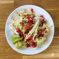 Delicious pork street taco Mexican recipe using slow cooker pork and a creamy guacamole recipe from Knorr.
