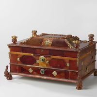 Game box with four smaller boxes, Anonymous, c. 1734. Amber, h 15.8 × w 30.2 × d 20.5 cm. Amber is fossilized resin, which in Europe is found primarily around the Baltic Sea. Amber from that region is approximately 40 million years old. Works of art in amber were crafted in Danzig, along the Baltic Sea. This game box was probably a gift from King Frederick William I of Prussia to Prince William IV and Princess Anne of England on the occasion of their wedding in 1734. -Rijksmuseum Amsterdam-