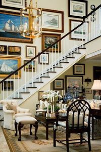 Gorgeous gallery wall going up the staircase in a traditional home.