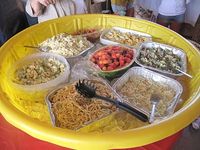 How to you keep food cold at a summer BBQ? A kid's pool filled with ice!
