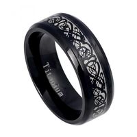 This ornately designed Celtic inspired ring is a modern take on a traditional design. Fashioned from black plated stainless steel, the middle groove features a celtic pattern etched in black on a silver background. This versatile piece will work well for formal or casual outfits or for daytime or evening events.