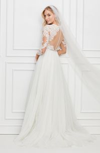 Romantic long sleeve a-line bridal gown with lace bodice, tulle skirt and plunging V neckline. #missrubybride *Only Available Off-the-Rack, No Reorders*