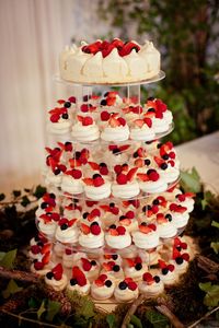 Mini pavlova wedding cakes with strawberries. Image by http://lolarosephotography.zenfolio.com/