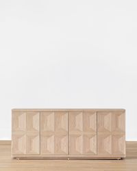 With a blend of geometric and organic motifs that add dimension and depth, the Beacon Sideboard takes a streamlined approach to visual intricacy. It includes spacious storage that makes it as functional as it is beautiful, creating a piece that brings practicality to design. With a neutral finish, the Beacon Sideboard