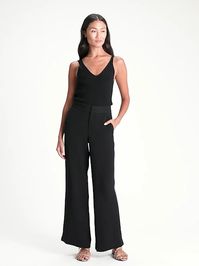 A high-waisted, wide-leg pant in full-length cut, made in one of our easy care fabrics. Zip fly with hook-and-bar closure. Front slant pockets. Rear welt pockets. Flat front. Trouser crease. Unlined. #ad