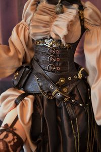 Included outfit: Bolero jacket - taffeta silk leather, lining viscose. Stylized corset - 100% silk taffeta + lawsuit. leather, embellished belts, buckles, scrap clockworks. Dress and shorts - delicate muslin. Stockings - Lace stretch. Basic skirt - 100% silk taffeta + trim straps and buckles. Blindfold - leather trim - hour scrap. Large belt with bag and compartments for cartridges - leather, metal. Small bag with belt - leather, metal. Belt with chains - leather, metal.