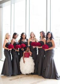 Glam bridesmaids in charcoal grey dresses with red rose bouquets. Wedding by Crystal Frasier Weddings. Photo by Thisbe Grace Photography. #wedding #bridesmaids #grey