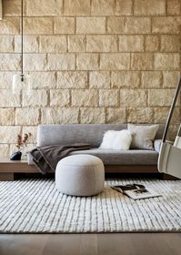 Silicon Valley studio Leverone Design created the interiors for Atherton Contemporary, a light-hued limestone house with similarly neutrally-toned furniture.