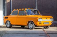 Deze NSU Prinz 1000 TT wordt te koop aangeboden door Classic Cars Heemskerk. De knaloranje TT werd geproduceerd in oktober 1969 en heeft 99.913km ervaring