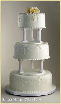 Classic Pillar Wedding Cake with piped swags and flowers.