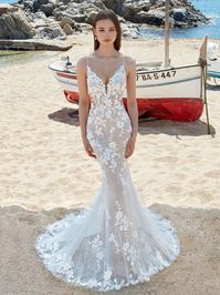 Romantic lace fitted wedding dress with plunging V neckline and illusion bodice. Available to try on in store in sizes 12 and 24 #MissRubyBride