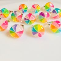 Made from a traditional Japanese candy coated in glitter resin.. Kintaro Ame is a traditional candy making technique. Ring is adjustable and sterling silver plated.