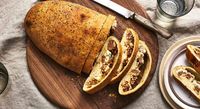This slice-and-share Sausage Bread is party food at its finest. It's easy to make, thanks to prepared pizza and spreadable cheese.