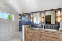 Stunning Blue Settecento Crayons tile with Brass Hardware. Light Gray countertops. White shower. #masterbathroom #bathroom #bathroomideas #bluetile #brasshardware #bathrooms #bathroominspiration #sconces #shower #shower ideas