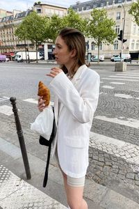 This white linen button down paired with white biker shorts is perfect for a casual stroll. Shop this look and more in the LTK app / https://liketk.it/3F0VP