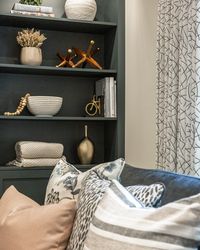 This recently remodeled home was ready for those final touches that bring the design together and transform the space. Styling the open shelving was the first item we tackled, curating a collection of items that not only reflected the young family that lives there but added warmth and visual interest. Layering in with custom art, draperies, furniture and fabrics created that family friendly atmosphere that exudes livable sophistication.