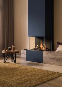 Trimline 63 Panorama These unique 3 panoramic build-in balanced flue gasfires can fully integrated in a wall. The panoramic shape of the fire will provide a perfect view on the exceptional flame picture! The flame picture is very realistic using the standard mixed log set or pebbles and cannot be distinguished from a real fire.