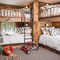 Any kid would have a great time in this rustic-style bunkroom! (📸: Jeff Roberts Photography) #thecottagejournal #bunkroom #bedroominspo