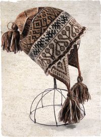 Our soft handloomed chullo is patterned in traditional Peruvian motifs in earthy shades of brown and cream, with pom-pom topper and tasseled...