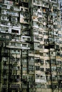 Battleship island in Japan. The entire island housed 3x what it should have, and managed it by putting them in obscenely crowded apartments like this. Now, the entire island is abandoned, and is restricted to the public. These derelict sky-scraping ghettos fall without an ear to hear them.