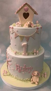 Little bunny rabbit and birdhouse birthday celebration cake with cherry blossom tree and hand painted bunting and toadstools