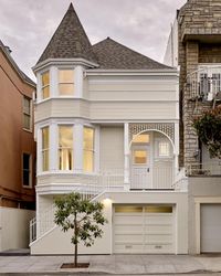 Its Queen Anne facade was preserved, but the interior of this Victorian was completely redone and transformed into a modern wonder. The grand San Francisco home now has an open floor plan with soaring ceilings across three stories, and a crisp white palette to highlight its architectural features, like the custom steel blade staircase.
