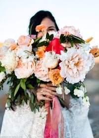 Create a stunning coral and blush peony bridal bouquet for your boho wedding.