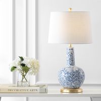 This modern take on chinoiserie features blue and white porcelain with an all-over vine pattern. This lamp has a classic gourd shape for a traditional look, and goldtone fittings to satisfy your inner maximalist. The silk-wrapped cord is an upscale touch.
