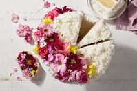 Old-Fashioned Coconut Cake | King Arthur Baking: Cardamom-scented coconut cake with silky coconut buttercream frosting and filling.