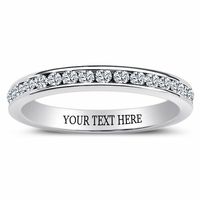 This exqusitely lovely eternity ring features clear cubic zirconia studs in channel setting on a sterling silver band. The thin band is highly polished for that sleek shine, further enhanced by the cubic zirconia stones. The ring may be worn as an anniversary or wedding band, and paired with a matching engagement ring.