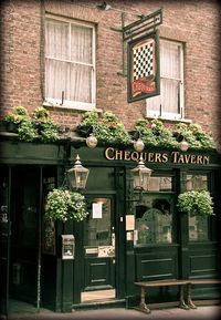 Chequers Tavern | London I love how they add plants to the facade . . . lovely...