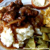 Beef tips and gravy over mashed potatoes