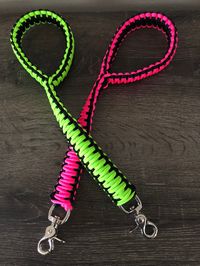 Customize your traffic leash with durable, fade and mildew resistant paracord. This is an approximately 1 foot 4 inch paracord dog traffic leash in your choice of 2 colors with a trigger snap. There is approximately 50 feet of paracord in each leash and is done in the king cobra weave that is doubled over to make it 1 inch wide. All paracord is 550 and made in the USA. The paracord is mildew resistant, fade resistant and can be washed. When ordering, please specify the 2 colors you would like. P