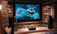 Family/theater room with screen set back and nice DVD storage.