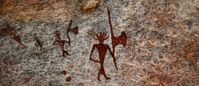 A miniature (9 cm × 6 cm) masterpiece at Chaturbhujnath Nala. The third figure, with hands on hips, is said to be the smallest rock art figure in all of Chaturbhujnath Nala.