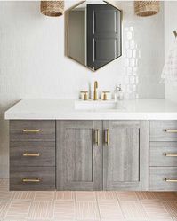 Natural wood, brass details and white tile in this pretty bathroom