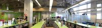 Conveyor runs across ceiling in children's area. Outside book return is on outside wall. Conveyor behind the protective cage carries items up to ceiling and across to next room.