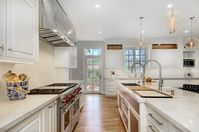 White Kitchen Design incorporating the Galley Workstation. L Shaped Island. #kitchendesign #kitchen #kitchenisland #whitekitchen