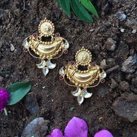 Product Details: Base Material - 92.5 Carat Pure Silver with Gold Plating Technique - Handcrafted Product Type -Temple Jewellery Design - Drops Stones Colour -Red And White Length - 2 inch Width - 1.5 Care Instructions - Avoid Contact with Perfumes and Water Contact No - +91 8095752326 E-Mail - contactus@madhurya.com Also available in Pure Gold* Shipping Worldwide