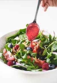 Raspberry poppy seed dressing made with fresh berries, olive oil, vinegar, and a touch of honey is SO much better than the bottled stuff ~ the bright flavor explodes in your mouth!