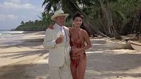 Here in this image, we again see suddenly retired Butler Coleman (Denholm Elliott) left & very new girlfriend Gladys (Donna Palmer) right as they celebrate his win against the old Duke Brothers in "Trading Places". Late actor Barry Dennan who starred as rehashed Hitler in Wonder Woman's "Anschluss '77" made a cameo as Dimitri in this movie. All images of THIS movie are courtesy of Google Search. Now, only Palmer, Ackroyd, Curtis, Hall, Murphy inclusively are still alive since the movie's debut.