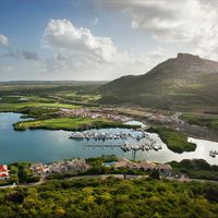 Dainty pink flamingos, a vibrant culture, and the bluest waters you've ever seen! That is the beautiful island of Curaçao—pronounced “cure-a-sow”—in a nutshell. You've likely heard of this enchanting Dutch Caribbean island, which forms part of the ABC island chain, including Aruba and Bonaire. But what you may not have heard, is that travelers can add Curaçao to their list of luxury-included vacations now that Sandals Resorts has announced plans to open at this idyllic destination.