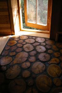 saw this floor done in a Chester County historic house using sawed ends of old barn beams...it was terrific and looked almost like ceramic tile...had to get down and feel it to be sure...looked silly but I got my answer!