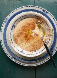 Norwegian Rømmegrøt. Rømme is basically sourcream or creme fraiche... and you make this dish by cooking the sourcream and whisking into it flour (ordinary white flour). So it's a bit like semolina, but... sour? And it's eaten with sugar and cinnamon, and the butter that was separated from the sourcream when it was heated. I can't wrap my head around this... I suppose I'd need to taste it.