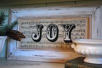 Turn an unused cupboard door into a sweet holiday sign with vintage sheet music and printed out letters.