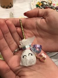 DIY Unicorn Lollipop using dumdums, gift tissue, and ribbon. (moms birthday presents ideas)