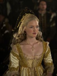 The Borgias (2011) - Holliday Grainger as Lucrezia Borgia wearing a pale gold silk dress with chartreuse beaded details on sleeves and bodice. The costumes were designed by Gabriella Pescucci.