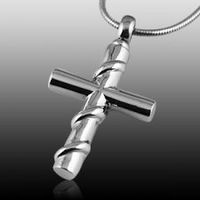 The Wrapped Cross Cremation Jewelry is wrapped with a silver steel band around the cross and is made of stainless steel. The quality is incomparable and the craftsmanship outstanding. This Keepsake Pendant can hold a small amount of the cremation ashes or a piece of hair to memorialize your loved one forever. You can keep your loved one close to your heart at all times. Top opening screw.